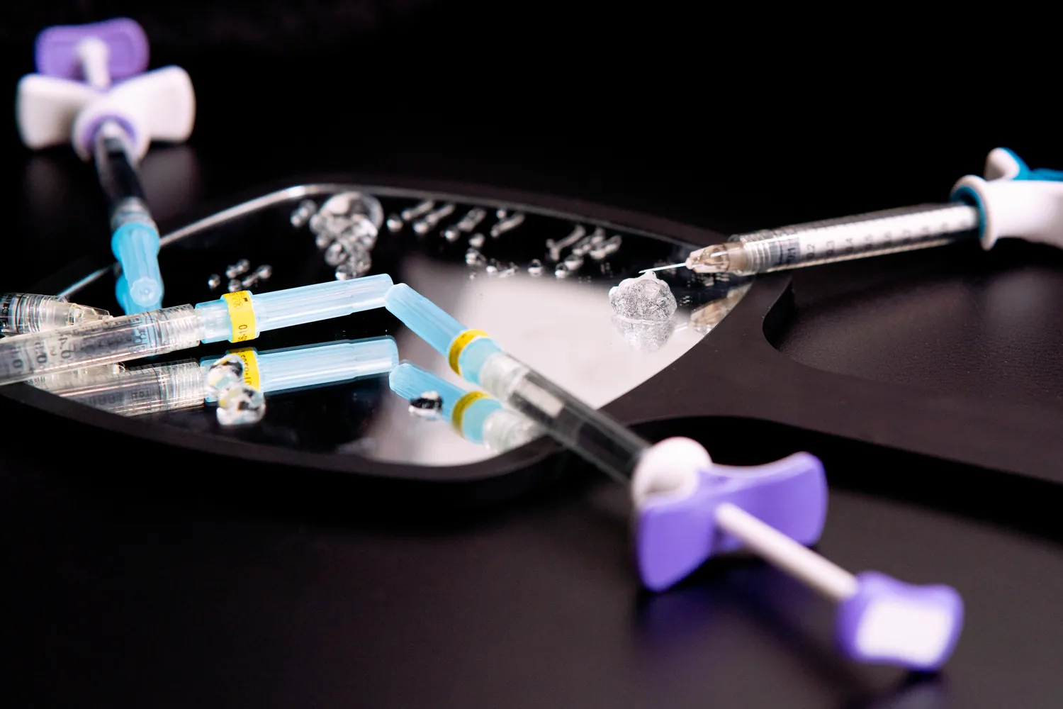 Sculptra and injectable products arranged on a tray