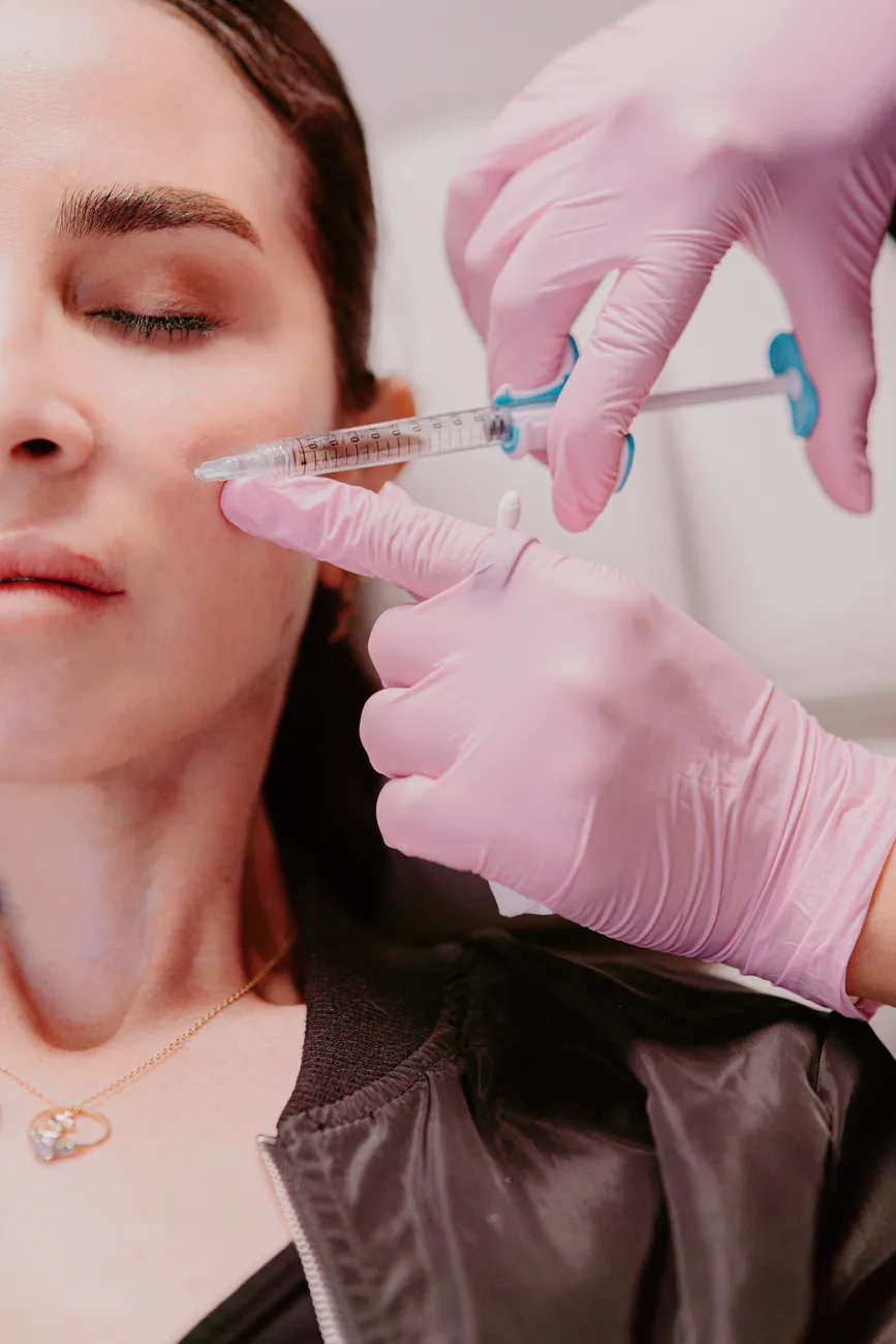A provider administering a neuromodulator treatment to the upper face